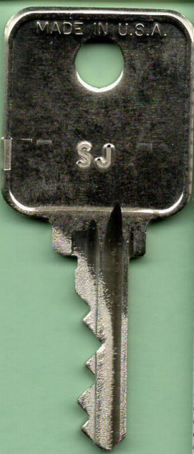 Aviation locksmith services: Keys & Cores can assist with specialized airplane security key needs.Close-up of an airplane key, showcasing the intricate design often found in aviation security keys.