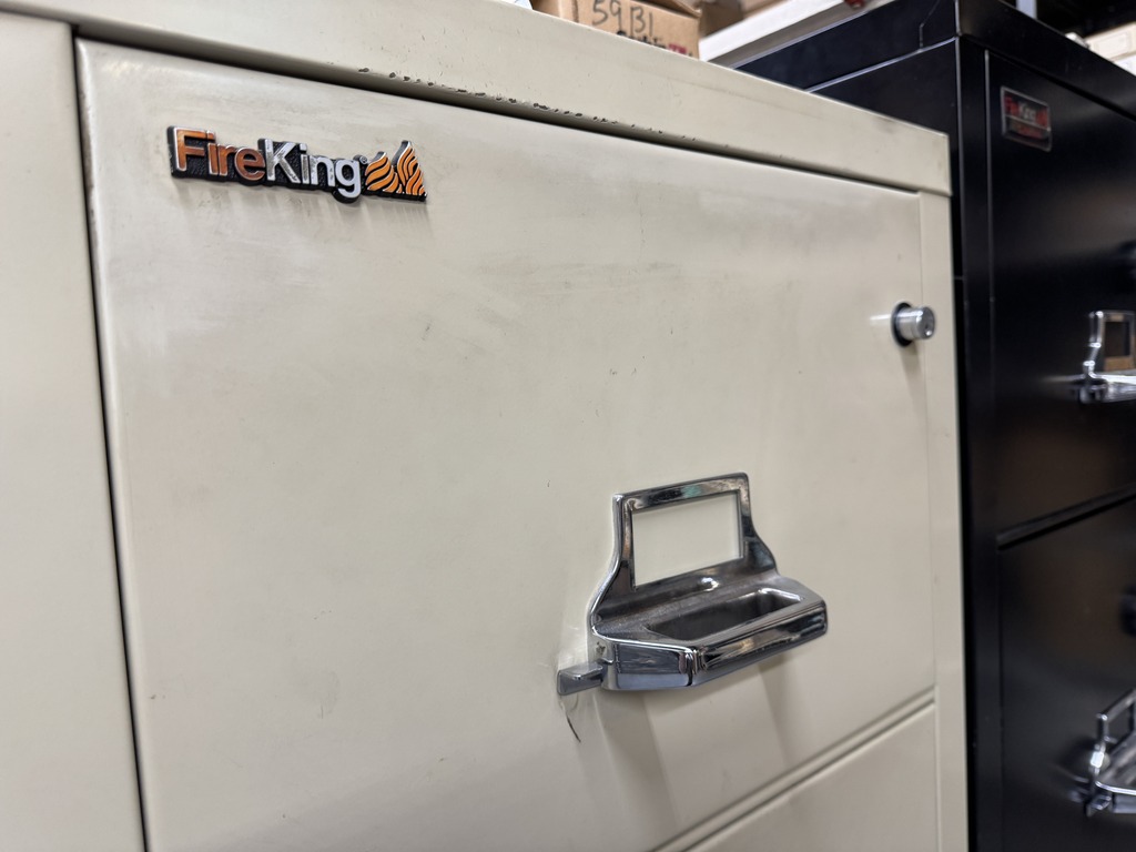 FireKing filing cabinet with visible lock cylinder, illustrating the type of cabinet where replacement Medeco keys are needed. The 'FireKing' logo is visible in the upper left corner.